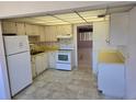Functional kitchen with standard appliances and view into adjacent living space at 5095 Bay Ne St # 310, St Petersburg, FL 33703