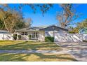 Charming home with a well-manicured lawn, mature trees, and a one-car garage at 5713 23Rd S Ave, Gulfport, FL 33707