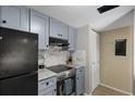 Well-organized kitchen featuring stainless steel appliances and ample cabinet space at 1055 82Nd N Ter # 1055A, St Petersburg, FL 33702