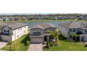 Beautiful home in a lakeside community with manicured lawns and paver driveway near other upscale homes at 10934 Sundrift Dr, Tampa, FL 33647