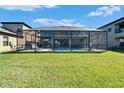 A spacious screened-in pool area offers an inviting outdoor living space at 12851 Tortoise Shell Pl, Riverview, FL 33579