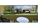 Enjoy the serene golf course views from the comfort of this cozy balcony at 36750 Us Highway 19 N # 01205, Palm Harbor, FL 34684