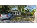 Delightful single-Gathering home with lush front yard landscaping and a well-kept lawn at 522 Mclennan St, Clearwater, FL 33756