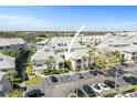 Aerial view of condo community with mature landscaping and assigned parking at 6915 Stones Throw N Cir # 3104, St Petersburg, FL 33710