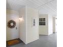 Entrance to condo with decorative wreath and welcome mat at 6915 Stones Throw N Cir # 3104, St Petersburg, FL 33710