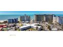 Shot of condo complex near the beach, several high rises visible in the background at 7050 Sunset Way # 26, St Pete Beach, FL 33706