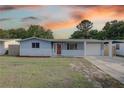 Charming single-story home featuring a stone facade and a well-maintained front yard at 7314 Princeton Dr, Hudson, FL 34667