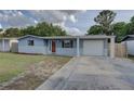 Charming single-story home featuring a stone facade and a well-maintained front yard at 7314 Princeton Dr, Hudson, FL 34667