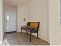 Inviting condo entrance with a comfortable bench seating area by the door at 960 Starkey Rd # 5406, Largo, FL 33771