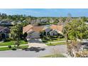 Beautiful home on a lush lot with verdant lawn and landscaping plus a pond at 10561 Greencrest Dr, Tampa, FL 33626