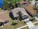 Aerial view of the home showcasing its roof, landscaping, and proximity to neighboring houses at 11322 Blackbark Dr, Riverview, FL 33579