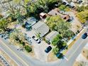 Overhead view reveals property layout including road access and car parking at 15 Shore Dr, Palm Harbor, FL 34683