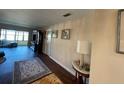 Spacious living room with hardwood floors, leading to sunroom at 1601 43Rd N St # 226, St Petersburg, FL 33713