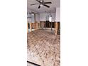 Renovation in progress revealing hardwood floors and exposed beams, ready for customization at 1743 Maryland Ne Ave, St Petersburg, FL 33703