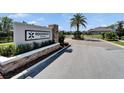 Entrance to Ridgewood Estates showcases manicured landscaping and a welcoming community sign at 2911 Silva Wood Dr, Valrico, FL 33596