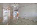 Bright and airy living room featuring neutral walls, polished floors, and an open layout perfect for entertaining at 3438 Bigelow Dr, Holiday, FL 34691