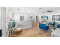 Stylish living room featuring tile floors and an open layout flowing into the kitchen at 9016 Bay Ne St, St Petersburg, FL 33702