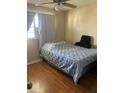 Cozy bedroom featuring a comfortable bed, a bright window, and soft, neutral tones at 10002 Daffodil N St # 51, Pinellas Park, FL 33782