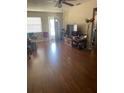 Spacious living room with hardwood floors, offering a welcoming and comfortable space at 10002 Daffodil N St # 51, Pinellas Park, FL 33782