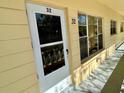 Exterior entrance features door and windows under covered porch and door number 32 at 2226 Switzerland Way # 32, Clearwater, FL 33763