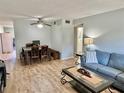 Open living space with wood floors, sofa, and dining area, offering a comfortable and inviting atmosphere at 2226 Switzerland Way # 32, Clearwater, FL 33763