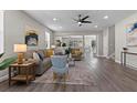 Spacious living room with wood flooring, neutral paint, and a ceiling fan at 2442 Silvermoss Dr, Wesley Chapel, FL 33544