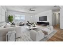 Bright living room features a ceiling fan, modern furniture, and luxury decor at 311 W Fern St, Tampa, FL 33604