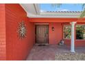 Inviting front entrance with a decorative door, terracotta tiles and a sunburst accent at 351 S Julia Cir, St Pete Beach, FL 33706