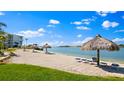Private beach with lounge chairs and umbrellas, perfect for relaxing by the water at 6001 Bahia Del Mar Cir # 429, St Petersburg, FL 33715