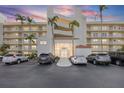 Elegant condo building featuring well-maintained landscaping, ample parking and a welcoming entrance at 6001 Bahia Del Mar Cir # 429, St Petersburg, FL 33715