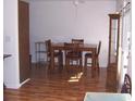 Charming dining room with table, seating for four, wood laminate floors and natural light at 8455 112Th St # 202, Seminole, FL 33772