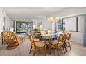 Open living and dining area featuring neutral paint, lots of natural light, and stylish furniture at 1728 Golfview Dr # 1728, Tarpon Springs, FL 34689