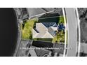 An aerial view shows the house with a well-maintained lawn, new roof, and a beautiful neighborhood at 3248 Anchor Bay Trl, Bradenton, FL 34211