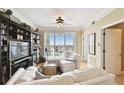 Bright living room with a balcony and large built in bookcase at 345 Bayshore Blvd # P9, Tampa, FL 33606