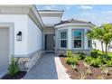 Inviting front entryway with manicured landscaping and decorative stone accents at 3563 Santa Caterina Blvd, Bradenton, FL 34211