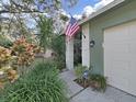 Close-up of home's entrance with neatly kept landscaping and a welcoming feel at 507 7Th Ne Ave, Largo, FL 33770