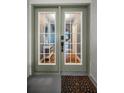 Elegant entryway features glass doors and views into the interior at 538 Walden Ct, Dunedin, FL 34698
