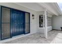 Inviting entrance with a modern blue front door and decorative sidelight windows at 5813 26Th N Ave, St Petersburg, FL 33710