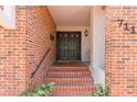 Charming brick entrance with double doors, stairs, and decorative address numbers at 711 S Oregon Ave, Tampa, FL 33606