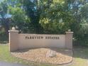 A welcoming Parkview Estates entrance sign flanked by decorative rock and greenery at 1220 Parkview Ln, Largo, FL 33770