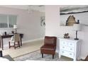 Comfortable space with white dresser, wood desk and chair at 12400 Park Blvd # 408, Seminole, FL 33772