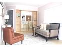 Inviting living room featuring a comfortable couch and stylish shelving at 12400 Park Blvd # 408, Seminole, FL 33772