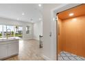 View of open floor plan living room and kitchen area with lift at 1623 Sea Haven Dr # 307, Punta Gorda, FL 33950