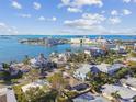 An aerial view of waterfront homes showing the homes proximity to the beach at 2451 Baywood W Dr, Dunedin, FL 34698