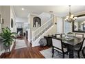 Elegant dining area with hardwood floors, staircase, and stylish decor for gatherings at 2915 W Bay View Ave, Tampa, FL 33611