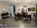 Elegant dining room with modern decor, chandelier, and stylish flooring at 3207 Sunwatch Dr, Wesley Chapel, FL 33544