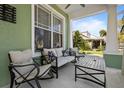 Inviting front porch with comfortable seating, perfect for relaxing and enjoying the neighborhood views at 3749 Zachary St, New Port Richey, FL 34655