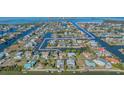 Aerial view of waterfront community with canals providing access to the Gulf of America at 4291 Flexer Dr, Hernando Beach, FL 34607