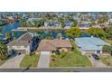 Waterfront home with lush landscaping, canal access, and a private boat dock offers tranquil living at 4291 Flexer Dr, Hernando Beach, FL 34607