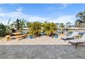 Outdoor patio area with lounge chairs, a picnic table, and views of the waterway at 4291 Flexer Dr, Hernando Beach, FL 34607